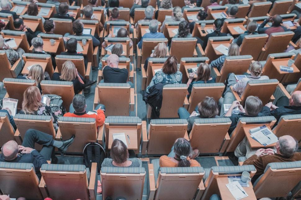 Diverse group of students collaborating in a bright lecture hall