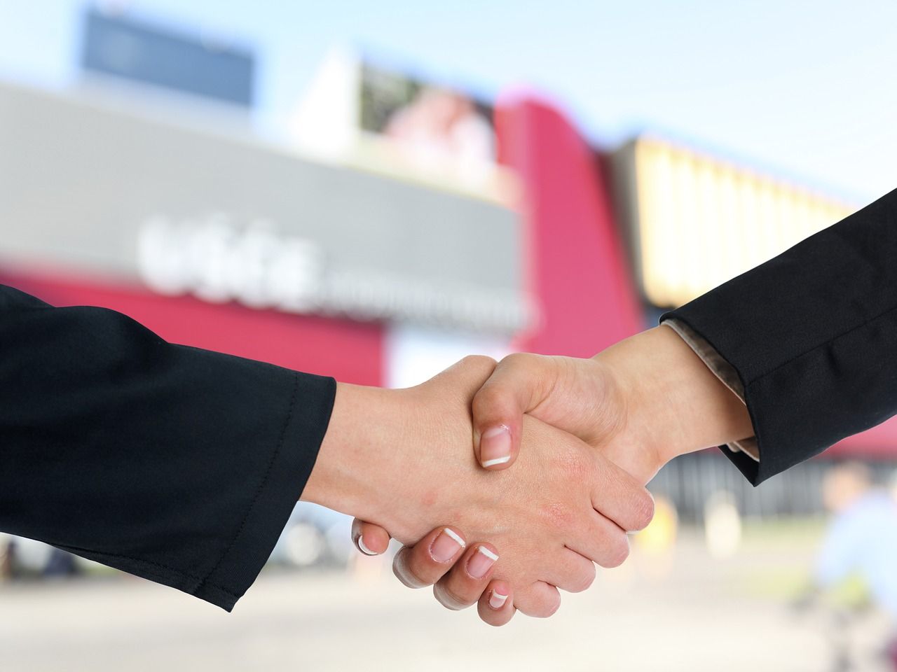 A handshake representing an agreement between an institution and a recruitment partner